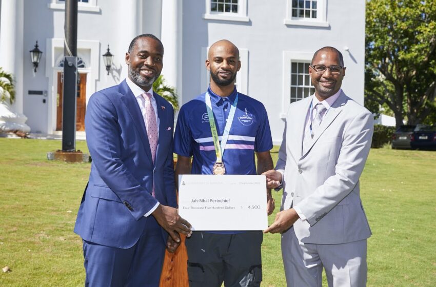  Premier Burt Presents a Check to Commonwealth Games Bronze Medal Winner Jah-nhai Perinchief